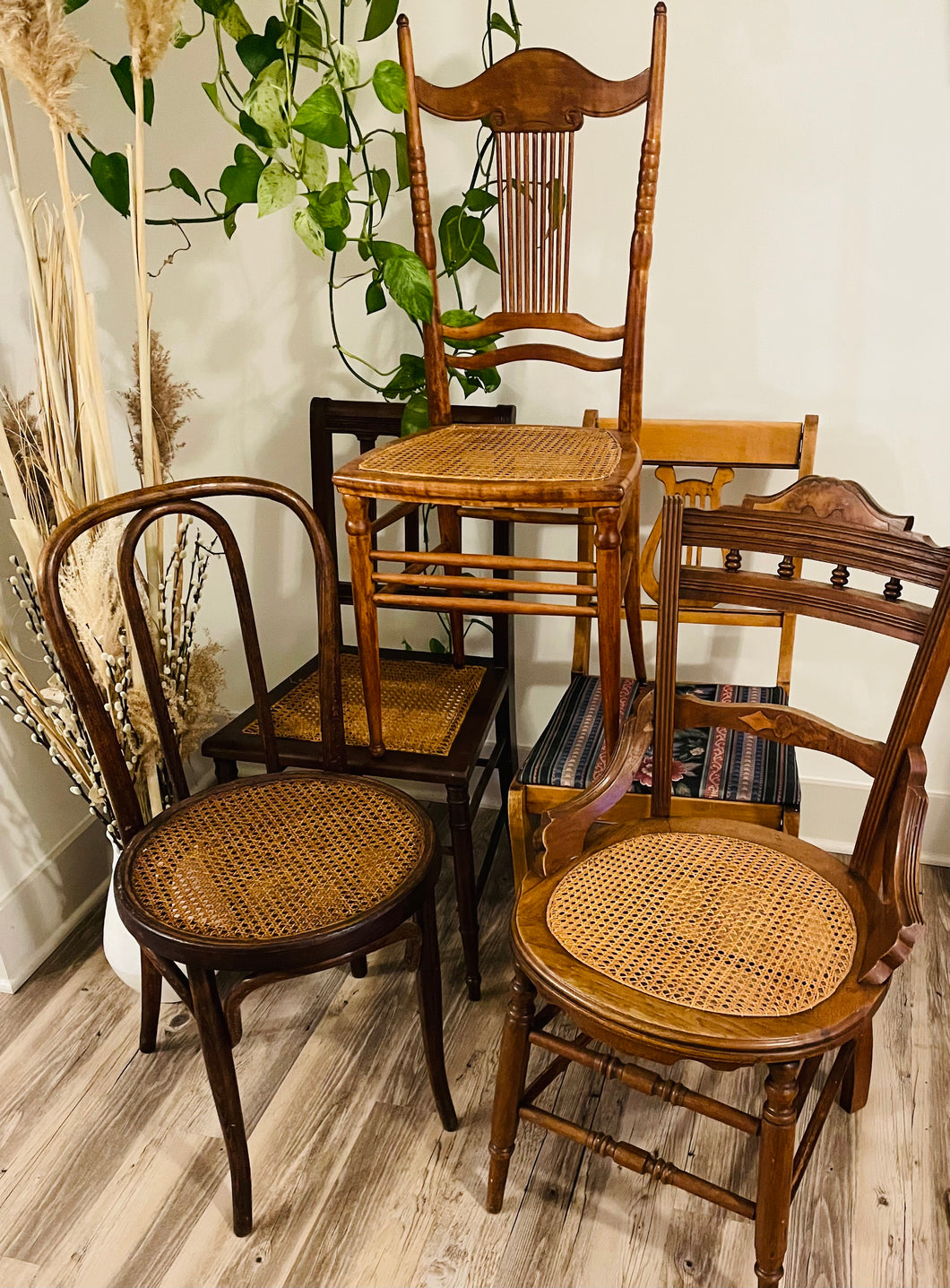 mismatched wooden chairs